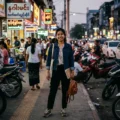 People walking on a busy city street in Yangon