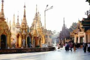 Capture of the iconic Shwedagon Pagoda with visitors, a symbol of Buddhism in Yangon, Myanmar.