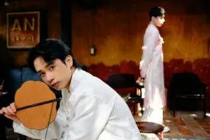 Captivating portrait of men in traditional Ao Dai at a cafe in Bến Tre, Vietnam.