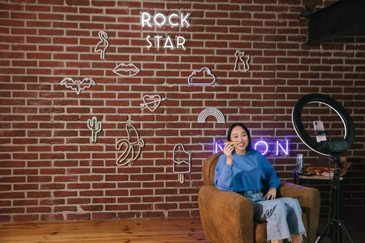Asian content creator streaming from a home studio setup representing the growing Myanmar YouTuber influencer culture in 2026