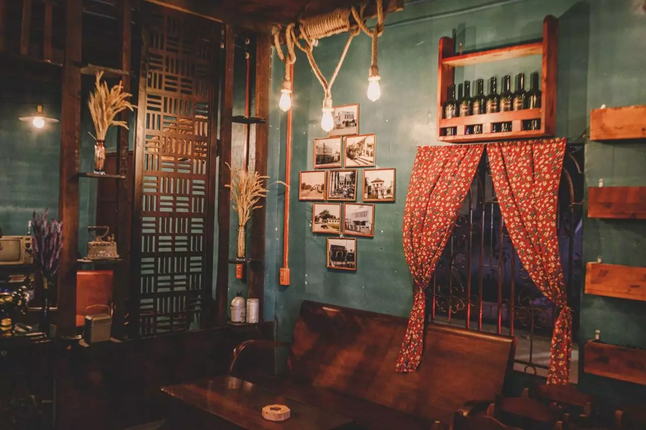 Warm and cozy aesthetic cafe interior with vintage decor and coffee equipment representing the most photogenic cafes in Yangon 2026