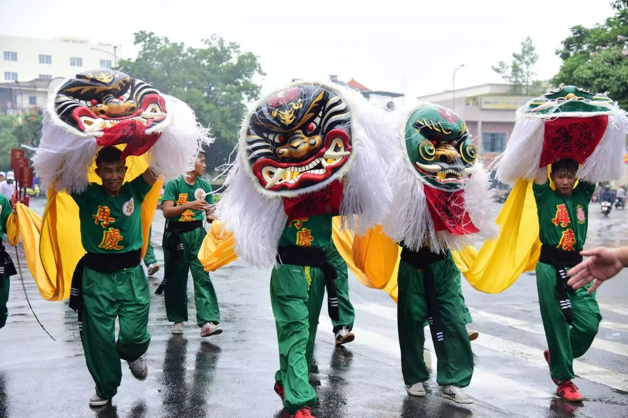 Lion dance performers at a festive street parade representing the vibrant Chinese New Year celebrations in Yangon 2026