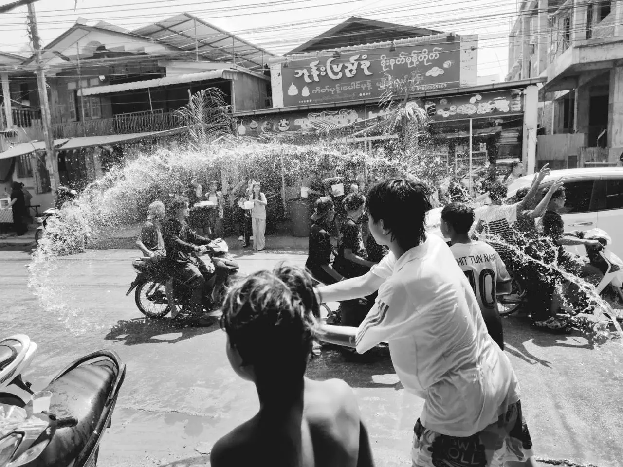 Energetic water festival celebration in Myawaddy Myanmar representing the 2026 Yangon Thingyan Maha Thingyan Pavilion festivities
