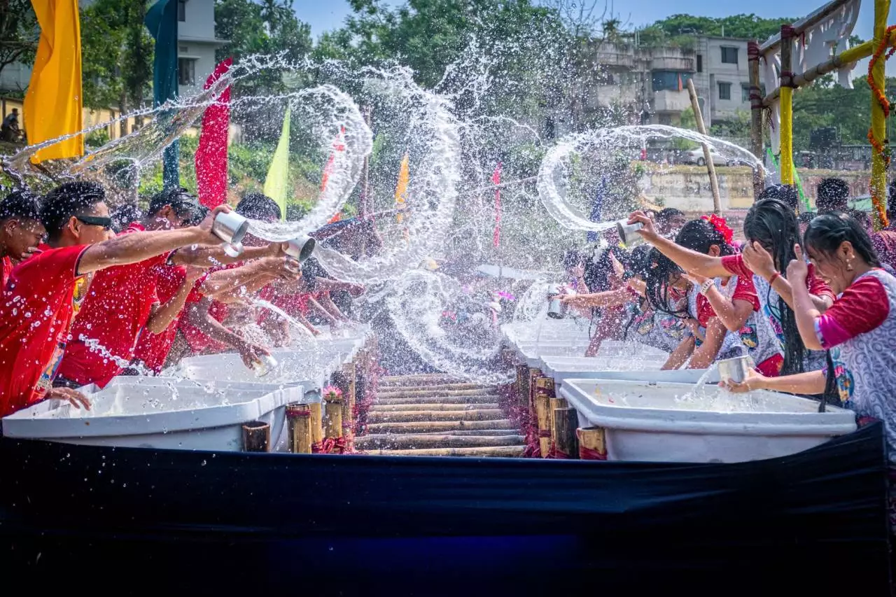 Joyful crowds splashing water at a traditional Myanmar Thingyan water festival celebration in Yangon 2026